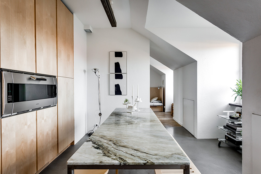 a kitchen of natural wood and steel